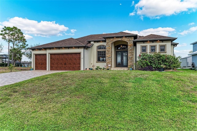 view of front of house with a garage and a front lawn