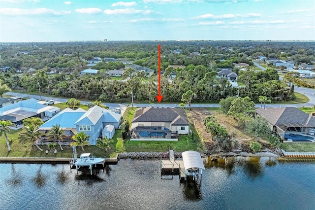 birds eye view of property featuring a water view