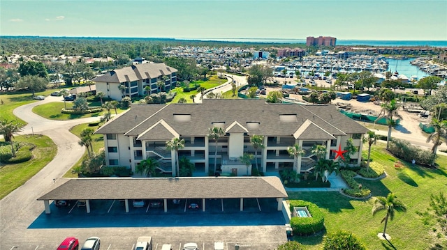 birds eye view of property with a water view