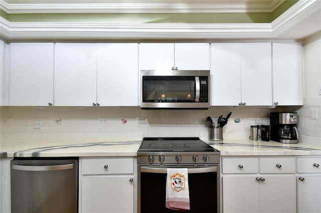 kitchen featuring stainless steel appliances and white cabinets