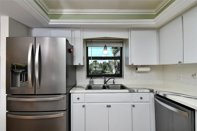 kitchen featuring stainless steel appliances, white cabinetry, and sink