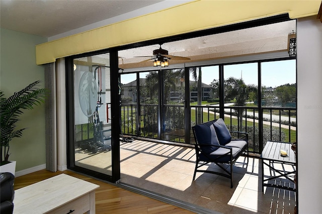 doorway to outside with ceiling fan