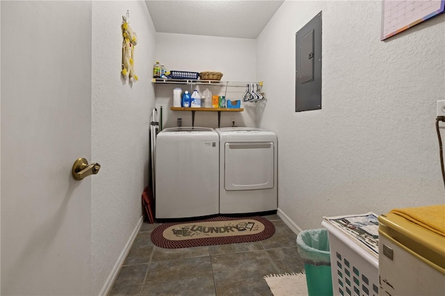 laundry area featuring washer and dryer, electric panel, tile patterned flooring, baseboards, and laundry area