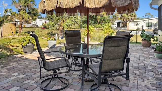 view of patio with outdoor dining area and a fenced backyard