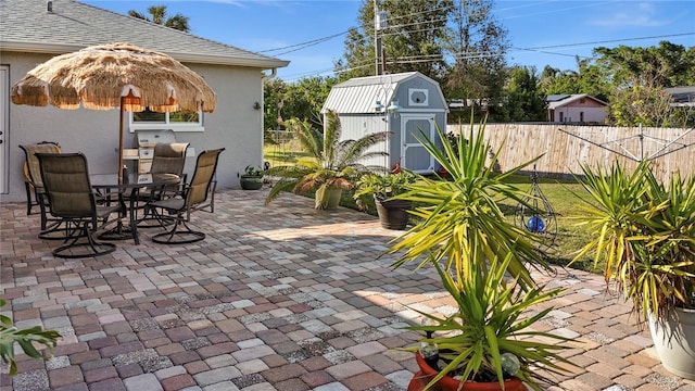 view of patio with a storage shed