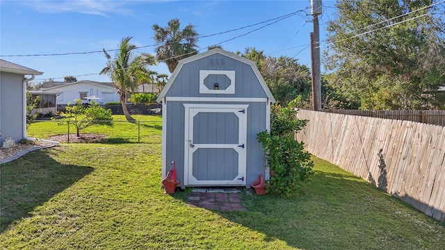 view of shed with a fenced backyard