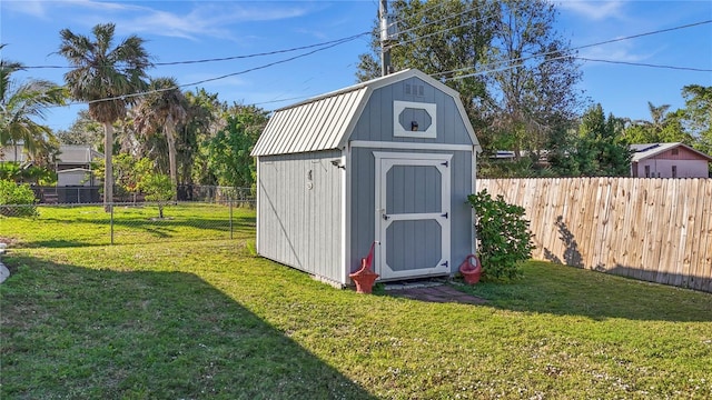 view of outdoor structure with a yard