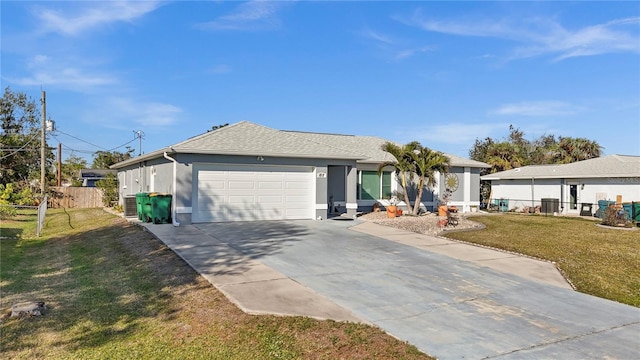 single story home with a front lawn, concrete driveway, fence, and an attached garage