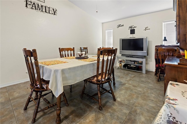 dining room with tile patterned floors and baseboards