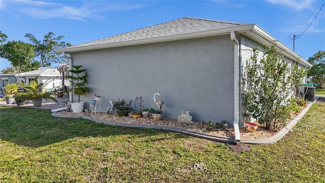 view of property exterior featuring stucco siding, a lawn, roof with shingles, and cooling unit