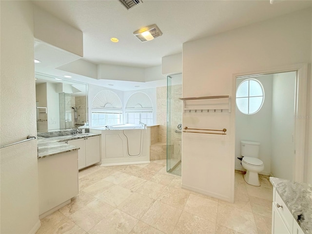 full bathroom with vanity, separate shower and tub, and a wealth of natural light