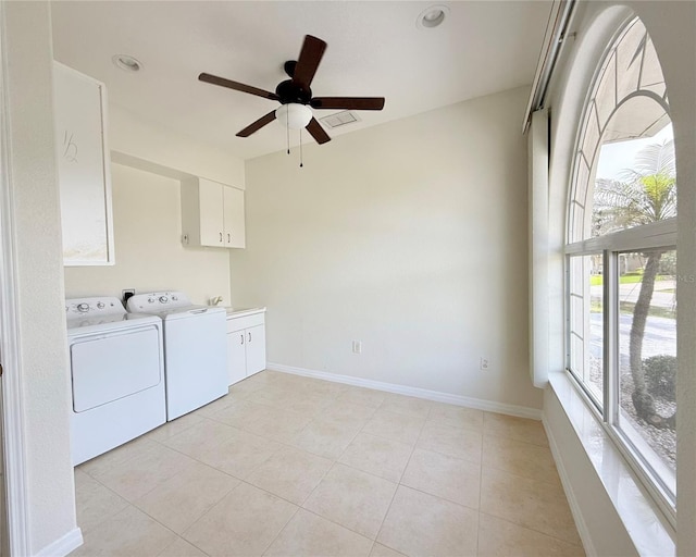 laundry room featuring cabinets, washing machine and dryer, light tile patterned floors, and ceiling fan