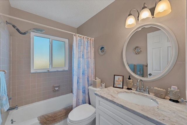 full bathroom with vanity, a textured ceiling, toilet, and shower / bath combo