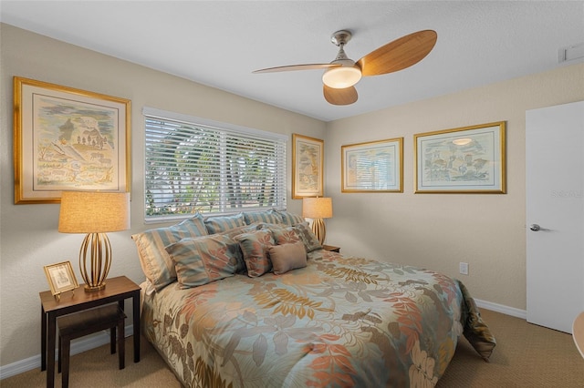 bedroom with ceiling fan and carpet