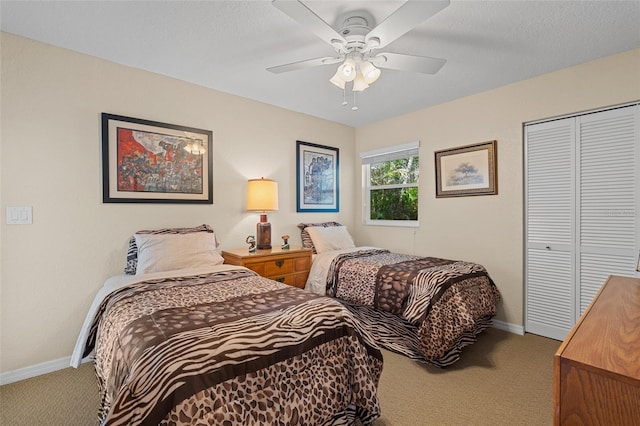 bedroom featuring carpet flooring, ceiling fan, and a closet