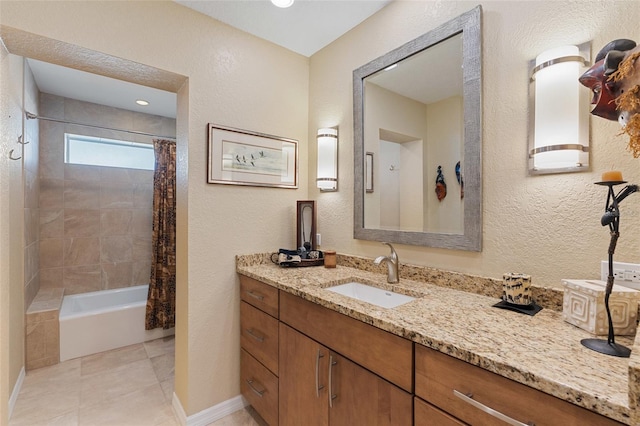 bathroom with tile patterned flooring, vanity, and shower / tub combo