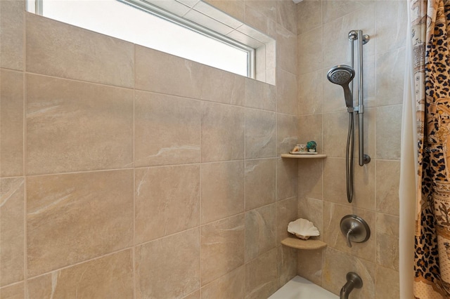 bathroom featuring shower / bathtub combination with curtain