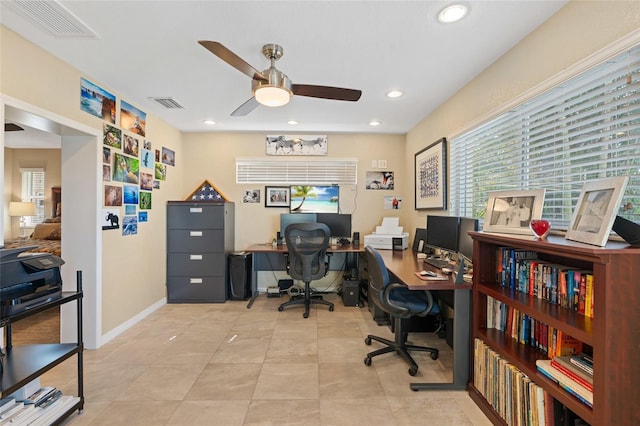 office area with light tile patterned flooring and ceiling fan