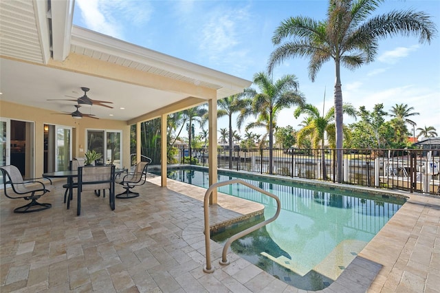 view of pool with a patio and ceiling fan