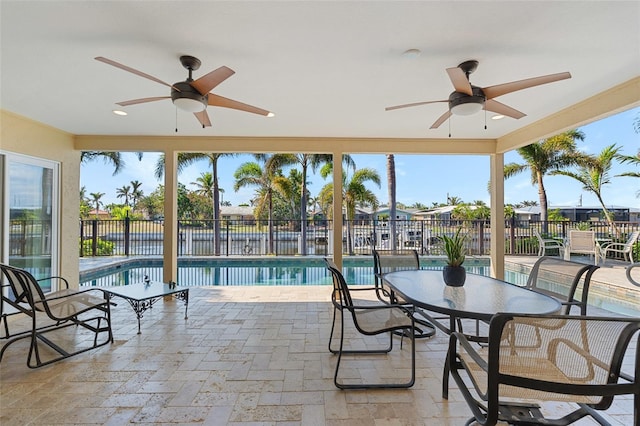 view of pool featuring ceiling fan and a patio