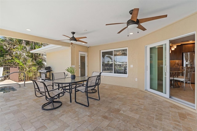 view of patio / terrace with grilling area and ceiling fan