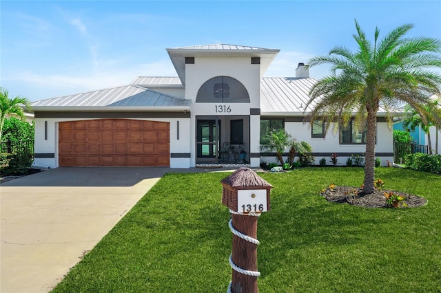 view of building exterior with a garage and driveway