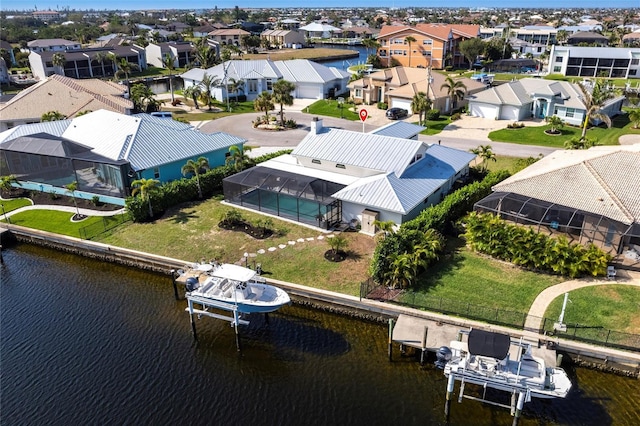 aerial view featuring a water view and a residential view