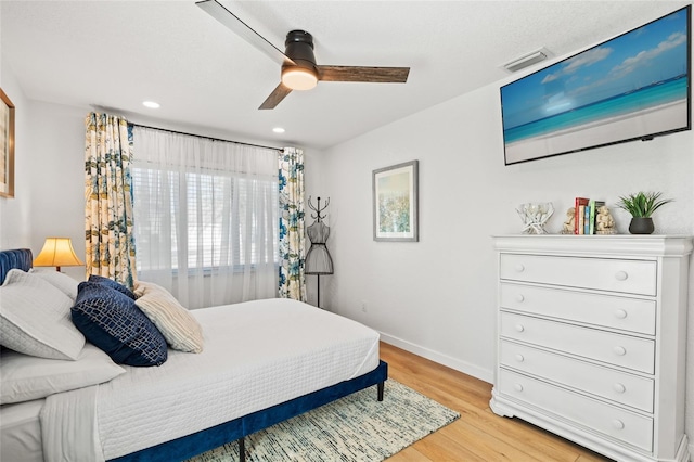 bedroom featuring visible vents, baseboards, ceiling fan, light wood-type flooring, and recessed lighting