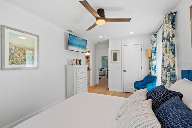 bedroom featuring recessed lighting, visible vents, baseboards, a ceiling fan, and light wood finished floors