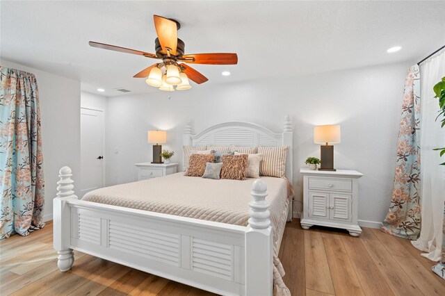 bedroom with visible vents, baseboards, light wood-style flooring, ceiling fan, and recessed lighting