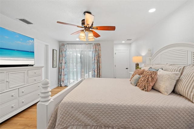 bedroom featuring recessed lighting, visible vents, and light wood-style flooring