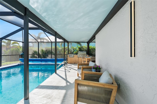 view of pool with a covered pool, glass enclosure, a patio, and area for grilling