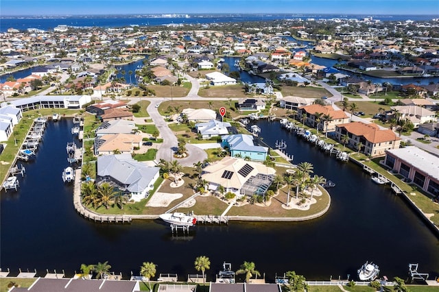 birds eye view of property featuring a residential view and a water view