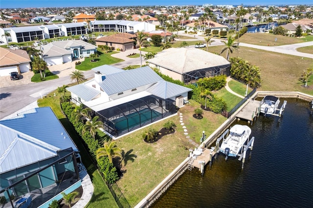 bird's eye view featuring a residential view and a water view