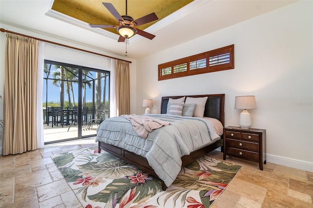 bedroom featuring ornamental molding, access to exterior, ceiling fan, and a tray ceiling