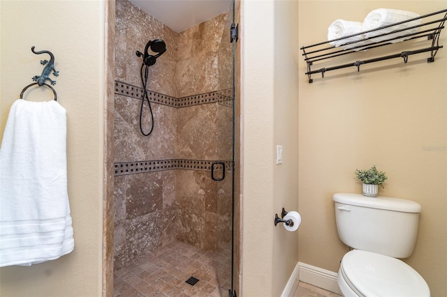 bathroom with walk in shower and toilet