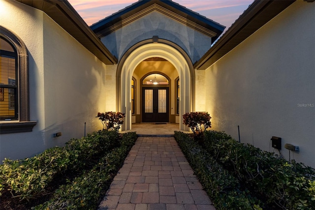 exterior entry at dusk with french doors