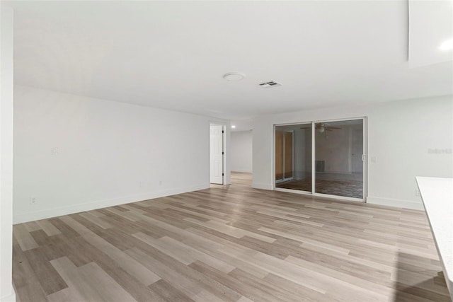 spare room featuring light hardwood / wood-style floors