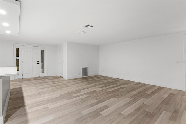 unfurnished living room with light hardwood / wood-style floors