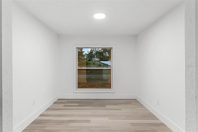 unfurnished room with light hardwood / wood-style flooring