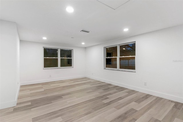 unfurnished room with light wood-type flooring