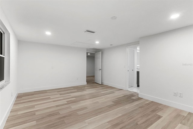 spare room featuring light wood-type flooring