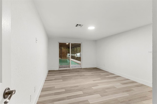 spare room featuring light wood-type flooring