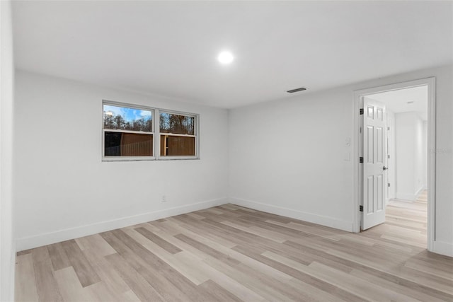 spare room featuring light wood-type flooring