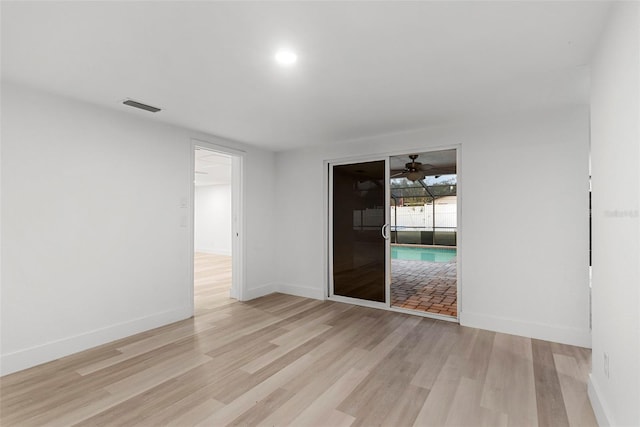 spare room featuring light wood-type flooring