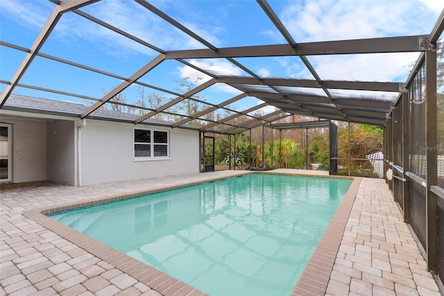 view of pool featuring a lanai and a patio