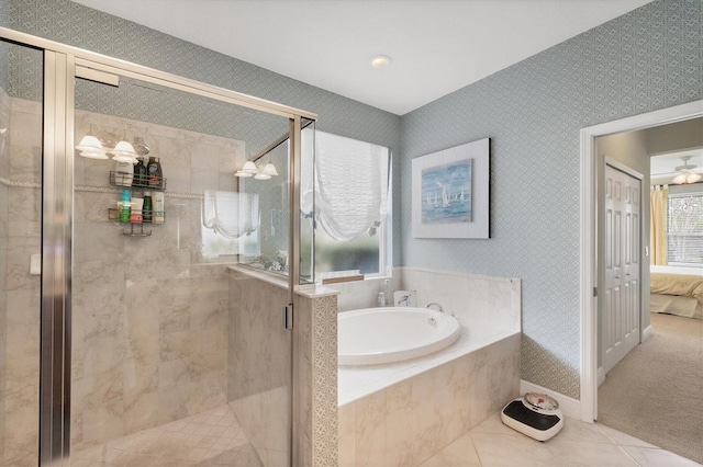 bathroom with tile patterned floors and separate shower and tub