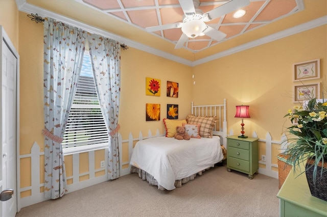 carpeted bedroom featuring multiple windows, ornamental molding, coffered ceiling, and ceiling fan