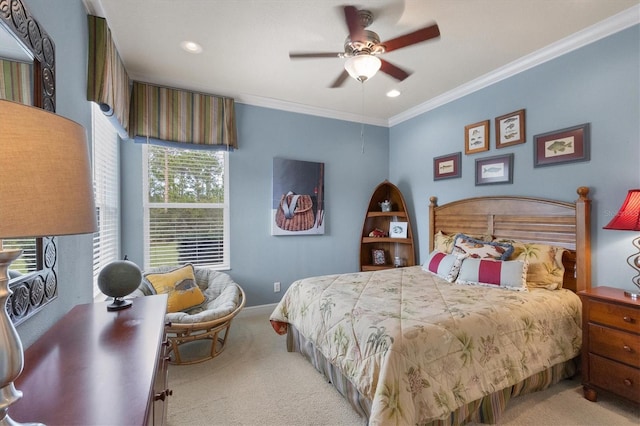 bedroom featuring light colored carpet, ornamental molding, and ceiling fan