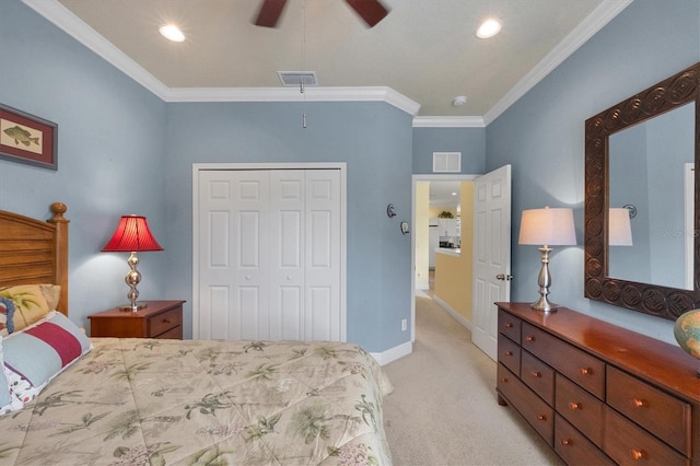 carpeted bedroom with ornamental molding, a closet, and ceiling fan